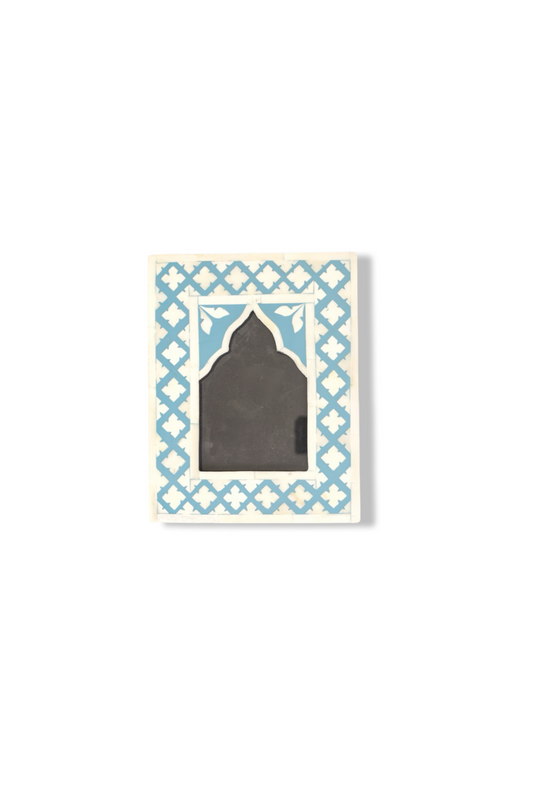 Decorative card with blue geometric pattern and black silhouette on a white background