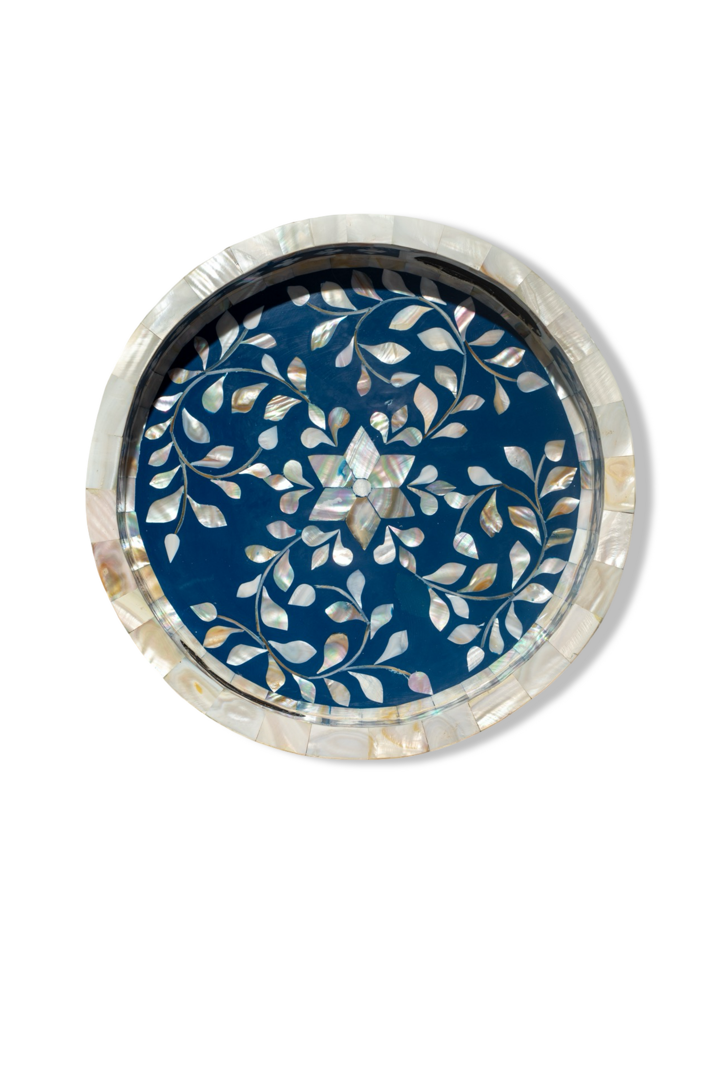 Decorative round object with blue floral pattern on a white background