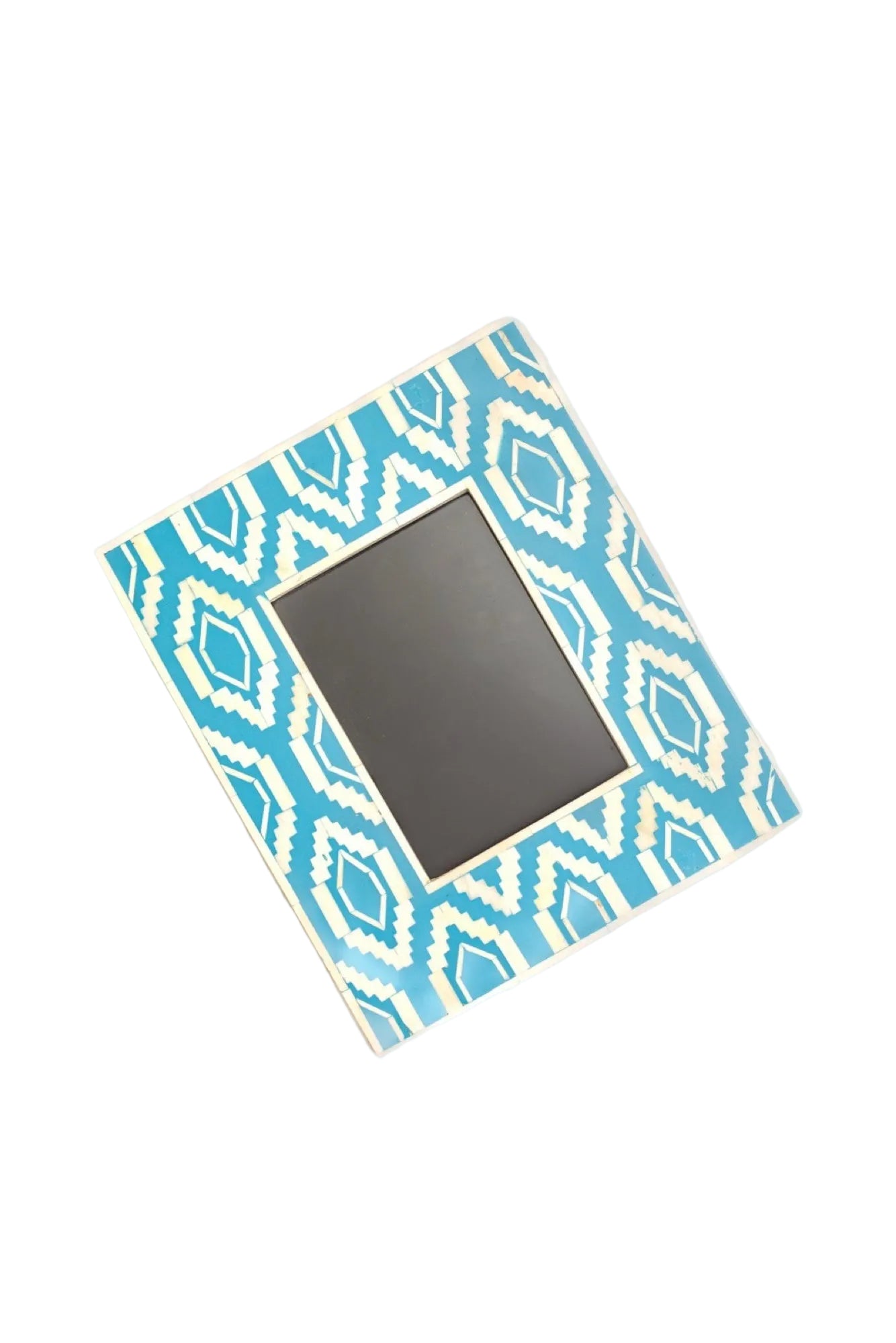 Small mirror with a blue and white geometric pattern on a white background